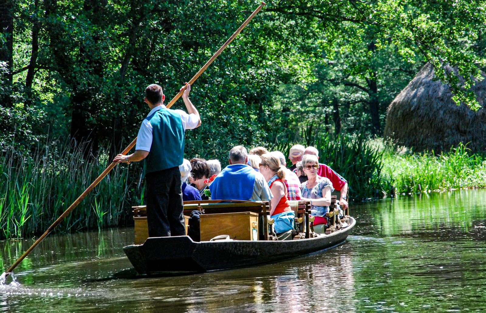 people riding on boat on river during daytime